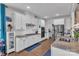 Bright kitchen featuring white cabinetry, stainless appliances, and granite countertops at 1115 Macallum Nw Dr, Concord, NC 28027