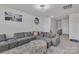 Comfortable living room featuring a gray sectional sofa and decorative accents at 1115 Macallum Nw Dr, Concord, NC 28027