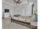Bright main bedroom with large windows, ceiling fan and an en-suite bathroom at 1115 Macallum Nw Dr, Concord, NC 28027