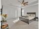 Sun-filled main bedroom boasts a ceiling fan, tray ceiling and an en-suite bathroom at 1115 Macallum Nw Dr, Concord, NC 28027
