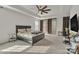 Spacious main bedroom with tray ceiling, fan, large windows, and lots of natural light at 1115 Macallum Nw Dr, Concord, NC 28027