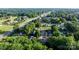 Aerial view of a community with tree-lined streets and surrounding greenery at 1124 St. Charles Ct # 3, Newton, NC 28658