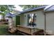 A backyard featuring a small wooden deck, green door and vinyl siding at 1124 St. Charles Ct # 3, Newton, NC 28658