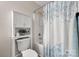 Bathroom with tub, shower, and vanity with storage and decorative shower curtain at 1124 St. Charles Ct # 3, Newton, NC 28658