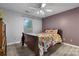 A bedroom with wood floors, a window, and a decorative bedspread at 1124 St. Charles Ct # 3, Newton, NC 28658