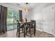This dining room features wood floors, modern lighting, and access to the deck at 1124 St. Charles Ct # 3, Newton, NC 28658