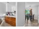 View of dining room and kitchen featuring wood floors and a hanging light fixture at 1124 St. Charles Ct # 3, Newton, NC 28658