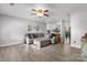 Spacious living room featuring light gray walls and wood grain flooring at 1124 St. Charles Ct # 3, Newton, NC 28658