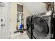 Convenient laundry room with modern washer and dryer, plus stylish tile flooring at 1152 Mckee Farm Ln, Belmont, NC 28012