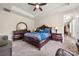 Comfortable main bedroom with neutral walls, tray ceilings, and wood furniture at 1152 Mckee Farm Ln, Belmont, NC 28012