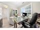 Bright office space with a large window and modern decor, creating an ideal work-from-home environment at 1152 Mckee Farm Ln, Belmont, NC 28012