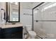 Modern bathroom with a glass shower and beautiful granite counters at 1233 Ladera Dr, Waxhaw, NC 28173