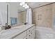 Bathroom with a double vanity and a tub with tile surround at 1233 Ladera Dr, Waxhaw, NC 28173