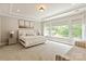 Bright and airy bedroom with large windows, a comfortable bed, and neutral decor at 1233 Ladera Dr, Waxhaw, NC 28173