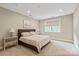 Bright bedroom features neutral carpet and a large window at 1233 Ladera Dr, Waxhaw, NC 28173
