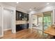 Inviting dining area with hardwood floors, a built-in cabinet, and access to an outdoor porch at 1233 Ladera Dr, Waxhaw, NC 28173