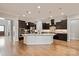 Large kitchen with granite counters, a central island, and plenty of storage at 1233 Ladera Dr, Waxhaw, NC 28173