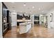 Spacious kitchen featuring a large island, stainless steel appliances, and dark wood cabinetry at 1233 Ladera Dr, Waxhaw, NC 28173