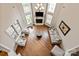 Bright living room with hardwood floors, fireplace, and large windows at 1233 Ladera Dr, Waxhaw, NC 28173