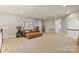 Cozy bonus room features neutral carpet and comfortable seating at 1233 Ladera Dr, Waxhaw, NC 28173