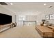Upstairs bonus room with neutral carpet and comfortable seating at 1233 Ladera Dr, Waxhaw, NC 28173