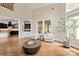 Open concept living space with hardwood floors, high ceilings, and comfortable seating at 1233 Ladera Dr, Waxhaw, NC 28173
