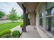 Spacious porch with stone pillars, offering a view of the well-maintained front yard at 1233 Ladera Dr, Waxhaw, NC 28173