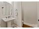Clean powder room featuring pedestal sink at 1233 Ladera Dr, Waxhaw, NC 28173