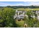 Aerial view of single Gathering home with mature trees and well-manicured yard at 124 Slocumb Ln, Mooresville, NC 28117