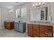 Elegant bathroom featuring double vanities with granite countertops and a window providing natural light at 124 Slocumb Ln, Mooresville, NC 28117
