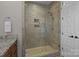 Modern bathroom featuring a glass-enclosed shower with tile surround and granite vanity at 124 Slocumb Ln, Mooresville, NC 28117