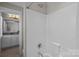 Well-maintained bathroom with a combined shower and tub, complemented by a neutral color scheme at 124 Slocumb Ln, Mooresville, NC 28117