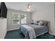 Inviting bedroom with a bed, neutral walls, and natural light from the window at 124 Slocumb Ln, Mooresville, NC 28117