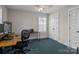 Comfortable bedroom with plush carpeting and a dedicated workspace at 124 Slocumb Ln, Mooresville, NC 28117