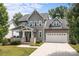 Charming two-story home with attached two-car garage and inviting front porch at 124 Slocumb Ln, Mooresville, NC 28117