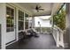 Charming front porch with comfortable seating and overhead fan at 124 Slocumb Ln, Mooresville, NC 28117