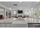 Open-concept kitchen showcasing a large island, granite countertops, and views of the living room at 124 Slocumb Ln, Mooresville, NC 28117