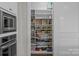 Well-organized walk-in pantry with ample shelving and storage space at 124 Slocumb Ln, Mooresville, NC 28117