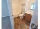 This bathroom includes a shower-tub combo and a wood vanity at 12450 Stone Garden Dr, Huntersville, NC 28078