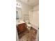 Tiled bathroom featuring a sink with vanity, toilet and bathtub with tiled floors at 12450 Stone Garden Dr, Huntersville, NC 28078