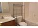 Bathroom featuring a toilet, vanity, and storage shelves next to the bathtub at 12450 Stone Garden Dr, Huntersville, NC 28078