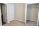This bedroom includes carpeted floors, a walk in closet, and access to a bathroom at 12450 Stone Garden Dr, Huntersville, NC 28078