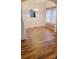 Dining room with hardwood floors, neutral colors, and updated lighting fixture, seamlessly connected to the kitchen at 12450 Stone Garden Dr, Huntersville, NC 28078