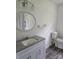 Bathroom featuring granite vanity, vanity lights and decorative oval mirror with great lighting at 125 Heritage View Rd, Hickory, NC 28601