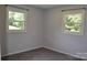 Bedroom with gray walls, carpet, and windows providing ample natural light at 125 Heritage View Rd, Hickory, NC 28601