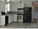 The kitchen features white cabinets, stainless steel appliances, and durable flooring at 125 Heritage View Rd, Hickory, NC 28601