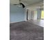 Inviting living room featuring plush carpeting, neutral paint and seamless flow into adjacent spaces at 125 Heritage View Rd, Hickory, NC 28601