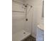 The bathroom has a modern shower with white tile and a chrome shower head at 125 Heritage View Rd, Hickory, NC 28601