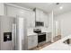 Modern kitchen features stainless steel appliances and light grey cabinetry at 135 Utility Ln # C, Mooresville, NC 28117