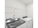 Laundry room featuring a new washer and dryer, along with wire shelving for storage at 135 Utility Ln, Mooresville, NC 28117